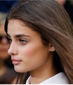 a close up of a woman with long hair