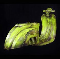 an old green scooter is shown against a black background