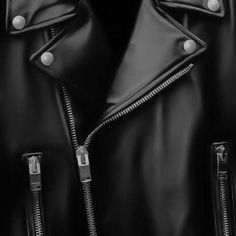 a black leather jacket with zippers on the sleeves