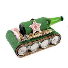 an army tank made out of beer cans and some peanuts in it with a star on top