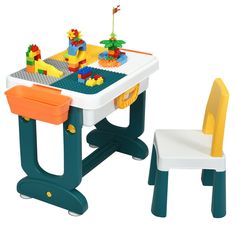 a plastic table and chair with legos on it