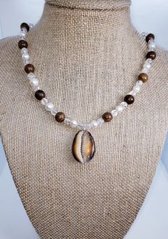 Please tap the link below to view my other BOHO jewelry products. www.etsy.com/shop/transcendenceboho COWRIE SHELL NECKLACE ITEM DETAILS This necklace has an expensive look at an economical price.  The mixture of cracked glass, wood and fresh water pearls is creative and stylish.  This necklace can be worn as a casual or dressy piece.  Regardless of how it is worn, it will always be chic. Standard Length:  17 inch.  Length  is adjustable. NOTE:   Gift bag included.  All necklace lengths are adju Tiger Cowrie Shell, Cowrie Shell Necklace, Caribbean Beach, Florida Girl, Beaded Necklace Diy, Beach Boho, Necklace Diy, Shell Necklace, Water Pearls