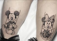 two mickey and minnie mouse tattoos on both legs, one is holding a balloon while the other