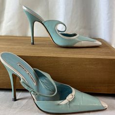 Manolo Blahnik Teal And White Pointed Heels Size 37.5 4" Heel Well Worn With Creased Leather And Slight Damage On Right Toes. Soles In Ok Condition. Designer Open Heel Fitted Heels, Designer Fitted Heels With Wrapped Heel, Designer Heels With Wrapped Heel And Fitted Design, Blue Heels For Spring Cocktail Events, Elegant Blue Heels With Contrasting Heel Counter, Luxury Fitted Heels For Spring, Designer 4-inch Heels For Spring, Elegant Blue Heels For Spring, Designer Fitted Closed Toe Heels