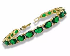 This exquisite yellow-gold bracelet with a stunning Green Emerald Oval Cut gemstone is the perfect blend of elegance and timeless beauty. Crafted with precision, the rich yellow-gold setting beautifully complements the vibrant green emerald, creating a piece that is both sophisticated and eye-catching. Whether you're looking for a special gift or a treat for yourself, this bracelet is perfect for any occasion, from anniversaries to birthdays. Its classic design ensures it will never go out of st Gold Oval Tennis Bracelet As Gift, Gold Oval Tennis Bracelet With Jubilee Design, Gold Oval Tennis Bracelet For Wedding, Gold Oval Bracelet With Gemstone, Elegant Green Round Gold Bracelet, Elegant Green Gold Round Bracelet, Elegant Green Gold Jubilee Bracelet, Green Oval Tennis Bracelet As Gift, Green Oval Tennis Bracelet For Gift