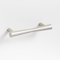 a metal handle on a white wall