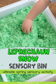 a child's hand in a white container filled with green sprinkles and the words leprechaun snow