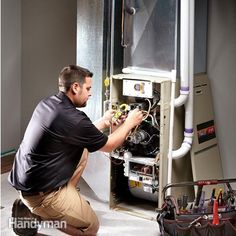 a man working on an electrical panel