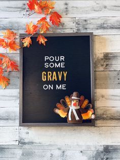 a sign that says pour some gravy on me with a turkey in front of it