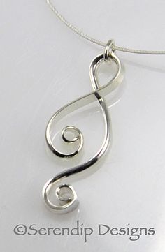 A lively Argentium Sterling Silver pendant from my Silver Swirls line, this beauty is hand-forged from domed Argentium silver wire for a three-dimensional effect. Named for my very talented artistic niece, my Ketta pendant is one of my most popular. It is polished to a high polish for a glowing shine that complements any outfit. This unique silver pendant comes on an 18 inch cable that is made of 49 very tiny steel cables that are bound together and coated with nylon embedded with Sterling Silve Hand Forged Silver Swirl Jewelry, Sterling Silver Swirl Jewelry, Sterling Silver Swirl Jewelry In Silver, Silver Swirl Wire Wrapped Jewelry, Silver Wire Wrapped Jewelry With Swirl Design, Silver Wire Wrapped Swirl Jewelry, Modern Twist Silver Wire Wrapped Jewelry, Handmade Swirl Jewelry With A Modern Twist, Modern Twist Swirl Jewelry As Gift