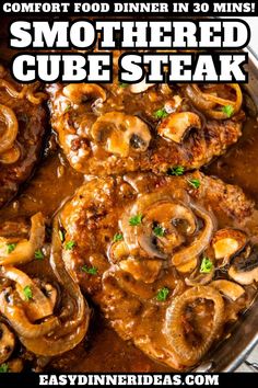 a close up of food in a pan with the words smothered cube steak