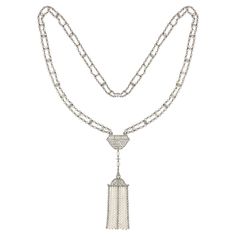 A Belle Epoque natural pearl and diamond sautoir necklace, centred with an openwork plaque of geometric design, encrusted with swiss-cut diamonds and pearls, suspending two pear-shaped pearls and a diamond bead terminating to a tassel, the scroll-designed top of the tassel suspending a fringe of three diamond-encrusted rows and six graduating rows of natural pearls, all hung from a long mesh chain of natural seed pearls and twenty one old-cut diamonds, accompanied by GCS Report stating that the Luxury Victorian Pearl Chain Jewelry, Luxury Victorian Jewelry With Pearl Chain, Luxury Long Necklace Fine Jewelry, Luxury Ceremonial Long Necklace, Luxury Vintage Long Necklace, Luxury Fine Jewelry Pearl Drop Necklace, Luxury Long Pearl Drop Necklace, Luxury Long Necklace With Intricate Design, Luxury Antique Single Strand Necklace