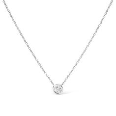 Embrace simplicity with a touch of timeless elegance with this exquisite pendant necklace, masterfully wrought from 10K white gold, and adorned with a 1/10 carat round brilliant-cut diamond. The diamond's natural origin assures its unique character, its sparkle cradled in a modern bezel setting that reflects a sleek, contemporary allure. H-I color and SI2-I1 clarity ensure a near-colorless shimmer, with slight inclusions that narrate the stone's authentic journey. The pendant dangles gracefully Solitaire Diamond Necklace, Diamond Necklace Simple, Diamond Solitaire Pendant, Open Heart Necklace, Future Self, Solitaire Pendant Necklace, Diamond Solitaire Necklace, Drop Pendant Necklace, Jewelry Essentials