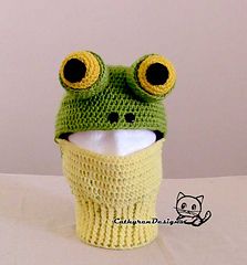 a crocheted frog hat with big eyes