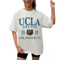 Cheer on the UCLA Bruins with effortless style in this Unity Oversized T-Shirt from Gameday Couture. This oversized tee boasts a relaxed fit for ultimate comfort. The distressed graphics showcase your UCLA Bruins pride by highlighting the school's town and the year it was founded. Gameday Couture, Ucla Bruins, Oversized T Shirt, Oversized Tee, Brand Colors, Oversized Tshirt, Cotton Shorts, Effortless Style, Black Shirt