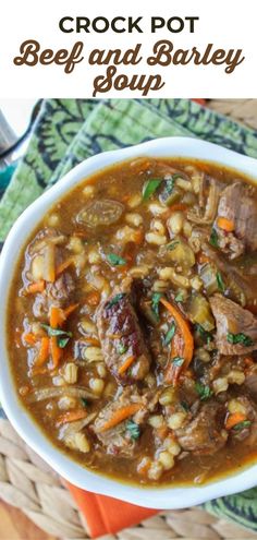 crock pot beef and barley soup in a white bowl with carrots on the side