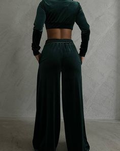 This velvet tracksuit set is a must-have for any fashion-forward baddie! The cropped jacket and wide leg pants create a stunning silhouette that's sure to turn heads. Made from soft, plush velvet fabric, this set is both comfortable and fierce. Whether you pair it with sneakers or clear heels, this chic and trendy outfit is perfect for any occasion. FIT, FABRIC & CUT Our model is wearing a size small for reference. The set is made from 100% cotton and is imported. It comes in a gorgeous green co Velvet Tracksuit, Clear Heels, Tracksuit Set, Color Care, Green Velvet, Crop Jacket, Wide Leg Pants, Pants Set, Trendy Outfits