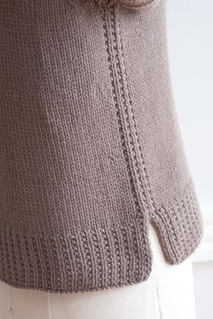 a woman's sweater is shown on a mannequin