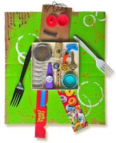 an assortment of items are displayed on a green cloth with scissors, fork and napkins