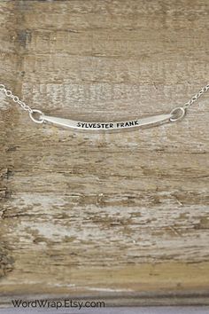 This dainty minimalist bar name necklace makes a beautiful gift. It is hand stamped in sterling silver with a name of your choice. Click through to customize your mothers jewelry. #WordWrap #WordWrapJewelry #HandmadeJewelry #Personalized #GiftsForWomen #Necklace #GiftsforHer #MothersDayGifts #HandStamped #PersonalizedGifts #MotherDayGifts #GiftsForMom #CustomNecklace #NameNecklace #MomGifts #PersonalizedNecklace #StampedJewelry #Minimalistjewelry Mothers Jewelry, Hand Stamped Ring, Minimalist Bar, Silver Wrap Ring, Stamped Rings, Mother Jewelry, Gold Rings Stackable, Jewelry Quotes, Kids Names