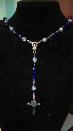 22 Inches around  ,27 inches long cross 2 1/2 in long 2 inches wide  beads ring,eye pins hook,rosary mary  beads -2 cm or smaller ,glass,acrylic Blue Cross Spiritual Necklace, Spiritual Blue Cross Pendant Necklace, Blue Cross Spiritual Jewelry, Blue Spiritual Cross Jewelry, Blue Crucifix Necklace For Spiritual Wear, Blue Crucifix Necklace For Spiritual Purposes, Blue Beaded Rosary As A Gift, Blue Spiritual Czech Glass Necklace, Blue Czech Glass Spiritual Necklace