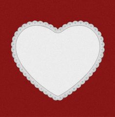 a white heart shaped frame on a red background