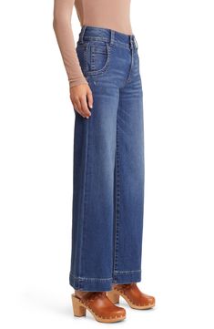 Make a casual-chic statement in these faded jeans featuring wide legs and low-stretch denim. 30 1/2" inseam; 22" leg opening; 11" front rise: 14 1/2" back rise (size 2) 93% cotton, 6% polyester, 1% spandex Machine wash, tumble dry Imported Fall Medium Wash Mid-rise Wide Leg Pants, Medium Wash Mid-rise Wide Leg Pants For Fall, Mid-rise Medium Wash Wide Leg Pants For Fall, Fall Medium Wash Cropped Wide Leg Pants, Fall Medium Wash Wide-leg Flare Jeans, Fall Cropped Wide Leg Pants In Medium Wash, Medium Wash Wide Leg Pants For Fall, Fall Light Wash Mid-rise Wide Leg Pants, Mid-rise Light Wash Wide Leg Pants For Fall