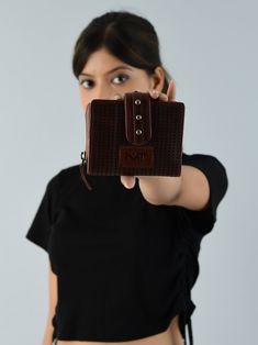 Experience practicality and durability with our Dark Brown Leather Bifold Wallet with Zipper. Made from resilient buffalo leather, it features a magnetic metal button closure adorned with four decorative metal buttons for added flair. Multiple cardholder compartments keep your essentials organized. The matte finish exterior with a fitted texture exudes timeless sophistication. This versatile accessory doubles as an everyday purse, offering classic design and functionality for various occasions. Everyday Purse, Leather Bifold Wallet, Buffalo Leather, Dark Brown Leather, Metal Buttons, Metal Decor, Dark Brown, Brown Leather, Card Holder