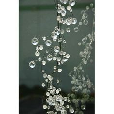 a close up of a chandelier with bubbles hanging from it