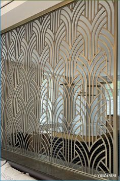 an intricate metal screen in the shape of art deco, on display at a store