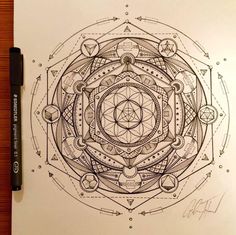 a pen drawing of a circular design on paper