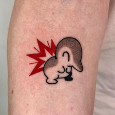 a person with a tattoo on their arm has a red lightning bolt coming out of his head