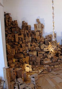 a room filled with lots of cardboard stacked on top of each other