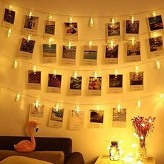 a living room filled with pictures and lights