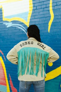 Dazzle the crowd in our show-stopping Sequin Rodeo Fringe Shirt. This isn't just a top; it's a statement. Sparkling sequins and playful fringe combine for a look that's equal parts glam and western. Perfect for the rodeo queen in you. Fitted Tops With Rhinestone Fringe For Spring, Spring Fitted Tops With Rhinestone Fringe, Fitted Spring Tops With Rhinestone Fringe, Trendy Fringe Tops For Festival, Fitted Tassel Tops For Fall, Spring Festival Tops With Beaded Fringe, Long Sleeve Fringe Tops For Festivals, Spring Fitted Tops With Beaded Fringe, Spring Fitted Top With Beaded Fringe