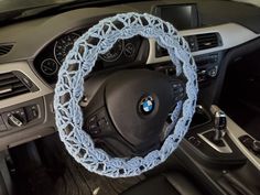 the steering wheel cover is made from blue yarn