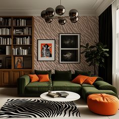 a living room with zebra print wallpaper and green couches in front of a bookshelf