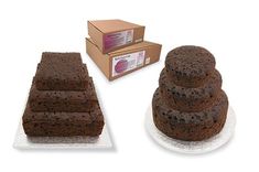 there are three cakes on the plate next to each other and a box of cake