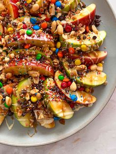 a white plate topped with fruit and nuts