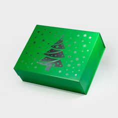 a green box with a christmas tree on it