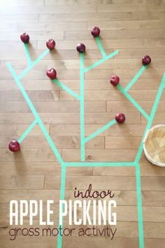 an apple picking gross motor activity for toddlers to play on the floor with apples