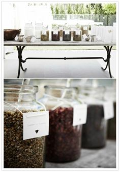 jars filled with different types of spices on top of a table next to each other