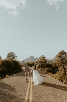 a newly married couple walking down the road