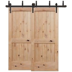 two wooden doors with black metal handles