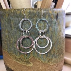 New earrings!! This pair of earrings was a custom order #etsy shop: Handmade Sterling Silver Interlocking Hammered Hoop Earrings http://etsy.me/2AMBmgF #jewelry #earrings #silver #sterlingsilver #interlockinghoops #hoopearrings #girlfriendgift #giftformom #everydayearrings Stamping Metal, Silversmithing Jewelry, Silver Smithing, Hammered Hoop Earrings, New Earrings, Earring Ideas, Idea Board, Silver Dangle Earrings, Nov 2