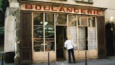 a man standing in front of a store