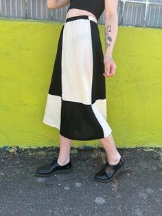 A black and white quilted mid length skirt with an elastic waistband * Hand sewn * 100% Linen Cotton * Elastic Waistband * Printed with high-quality eco-friendly ink Want the skirt shorter? We offer custom lengths at no additional cost. If you decide to go this route please email us after your purchase with your order number and we'll add it to your order note. Although please keep in mind that due to the weight of the fabric, mini skirt lengths are not advised. The model is 5'9 and wearing size White Midi Bottoms With Elastic Waistband, White Midi Length Bottoms With Elastic Waistband, Black Patchwork Tiered Skirt, Black Tiered Patchwork Skirt, Casual White Patchwork Skirt, Casual White Skirt With Patchwork, Retro Black Long Skirt, Black And White Quilts, Skirt Linen