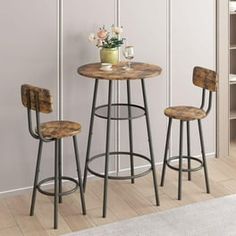 three stools and a table in a room