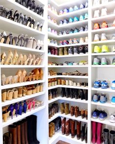 a closet filled with lots of different types of shoes