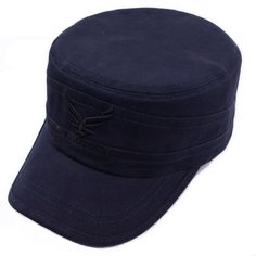 a black hat with a bird embroidered on the front and side, sitting on a white surface